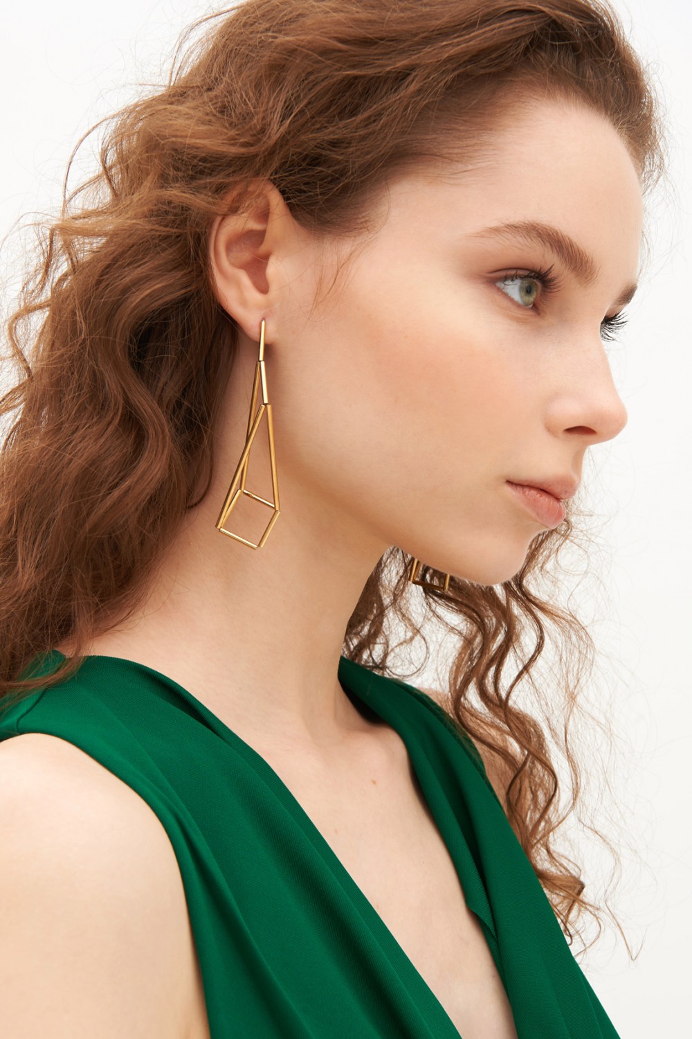 Gold earrings in the shape of origami