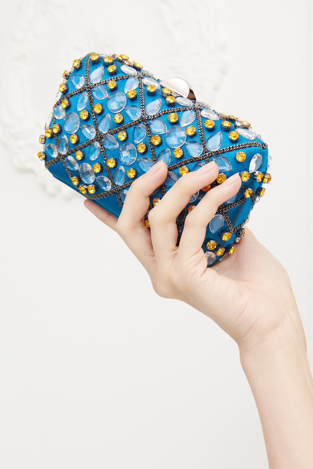 Blue silk clutch with crystals and chains